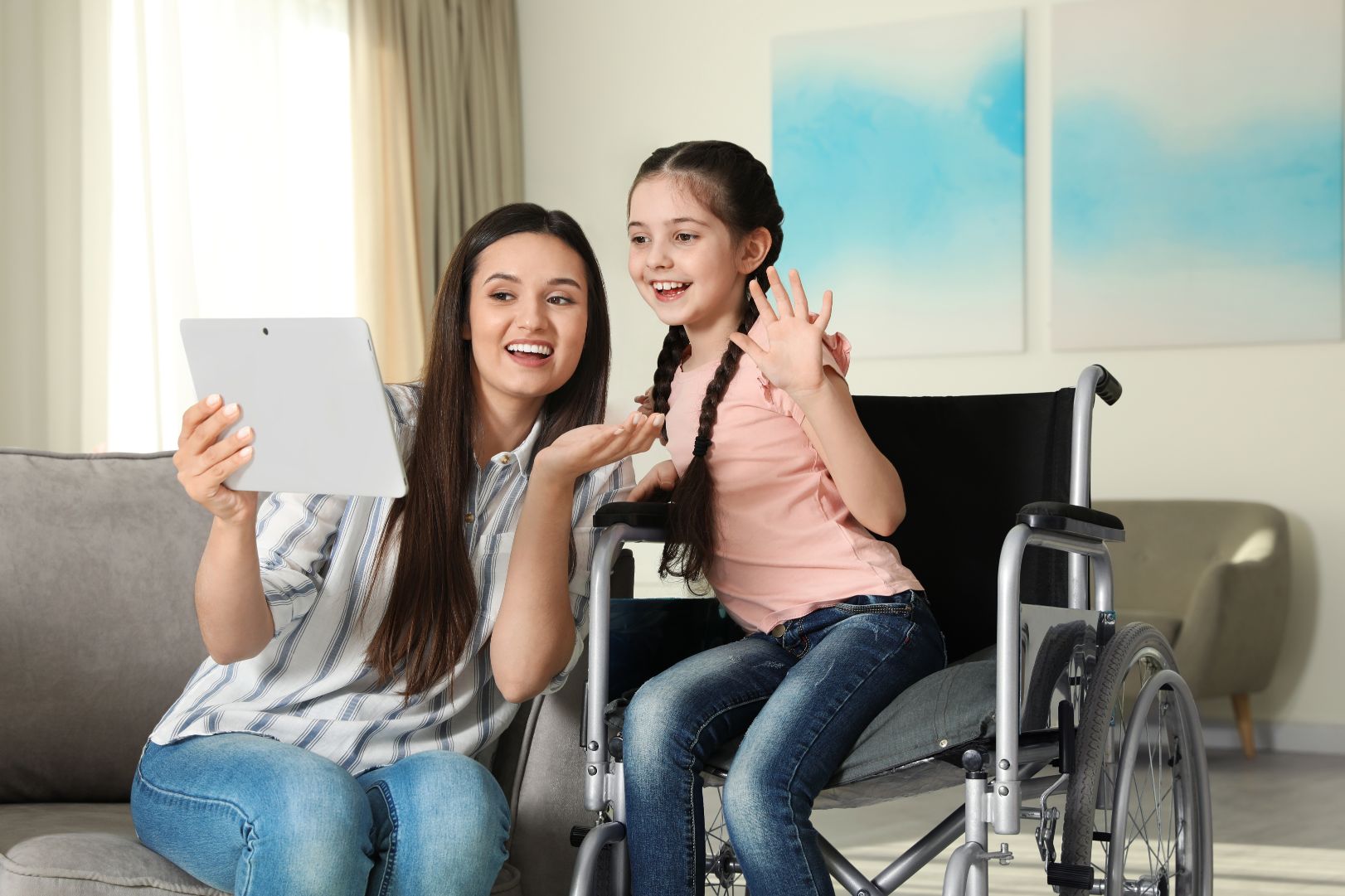 Girl in wheelchair with her mother